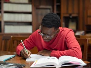Young man studying in the library