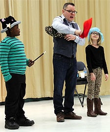 Magician Scott Davis shares the magic of electrical safety with the help of Myles Shackelford and Makaylah Cantrell, students from Crowders Creek Elementary School in Clover. Photo: Cameron Moore